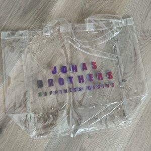Jonas Brothers Happiness Begins Clear Tote Bag with Colorful Text